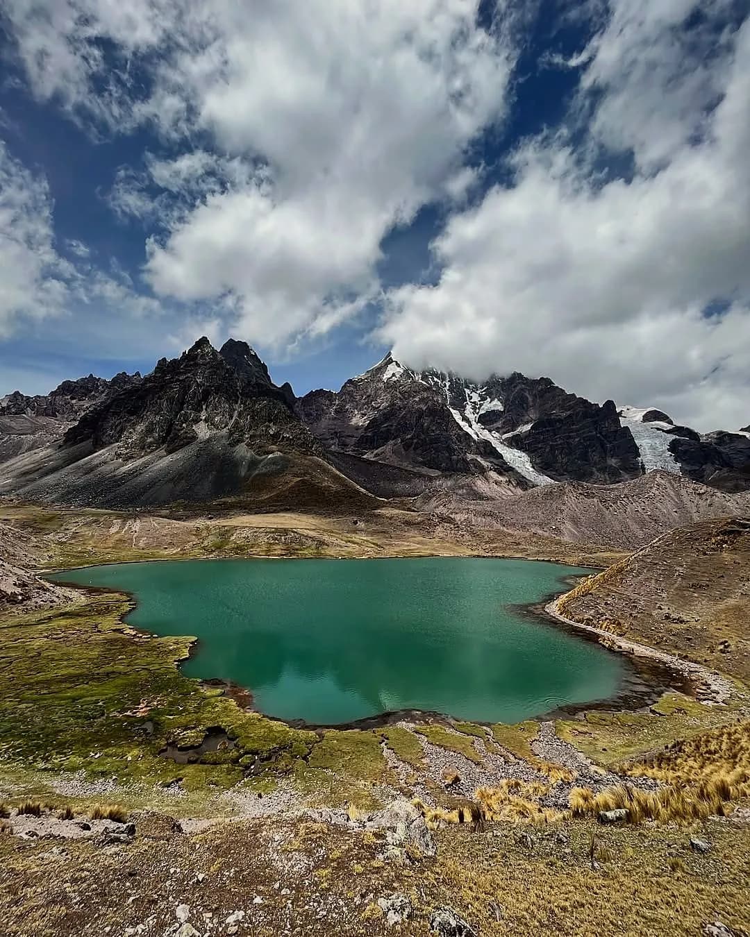 Turquoise lake among mountains on the seven lakes route in Ausangate