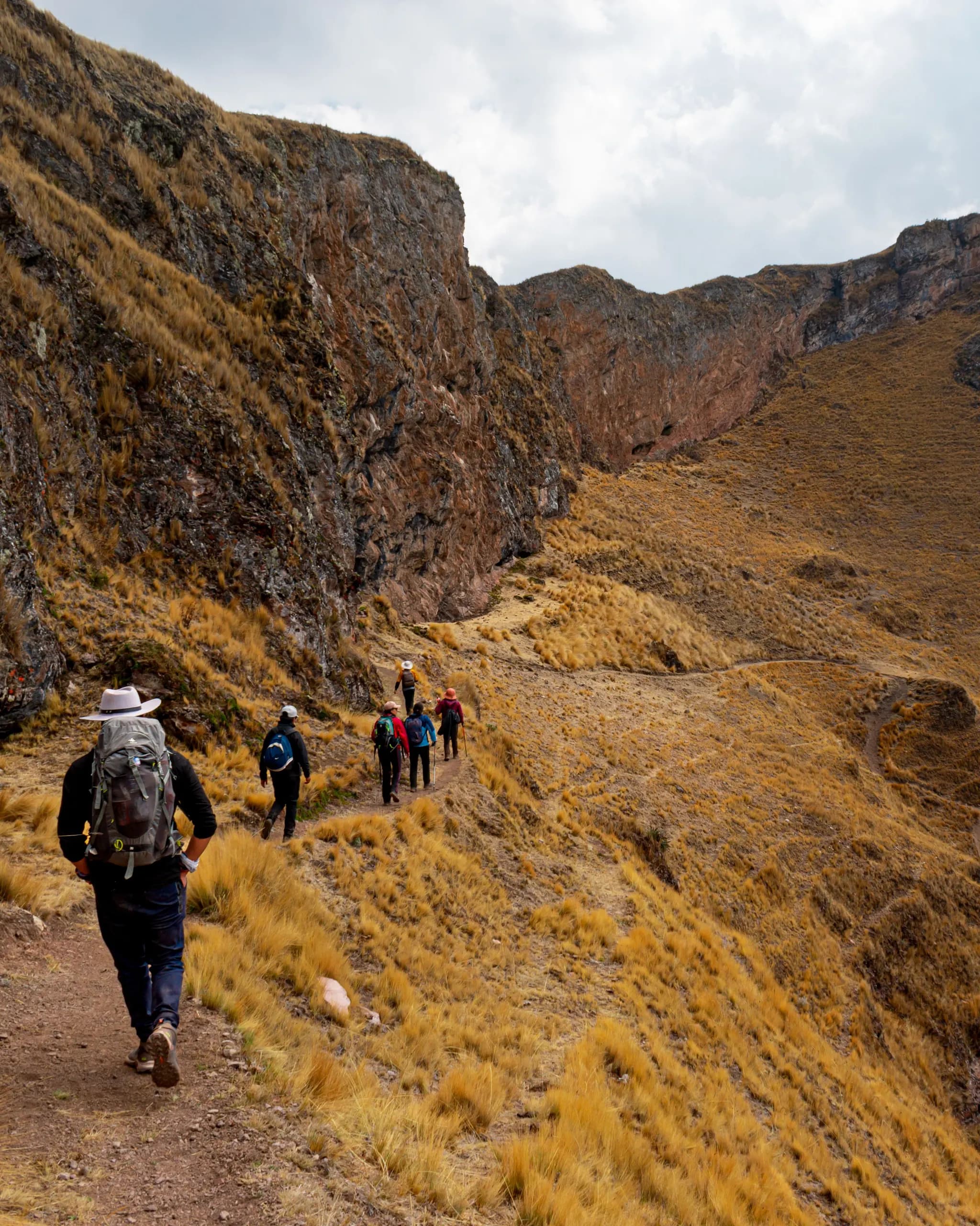 Hikers following a mountain trail near Ollantaytambo, Cusco