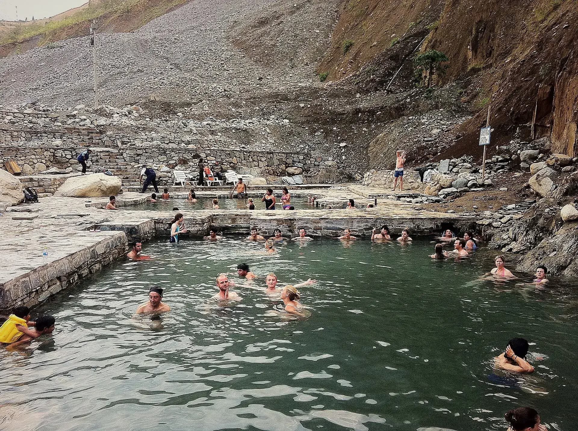 Cocalmayo hot spring pools beside rocky slopes