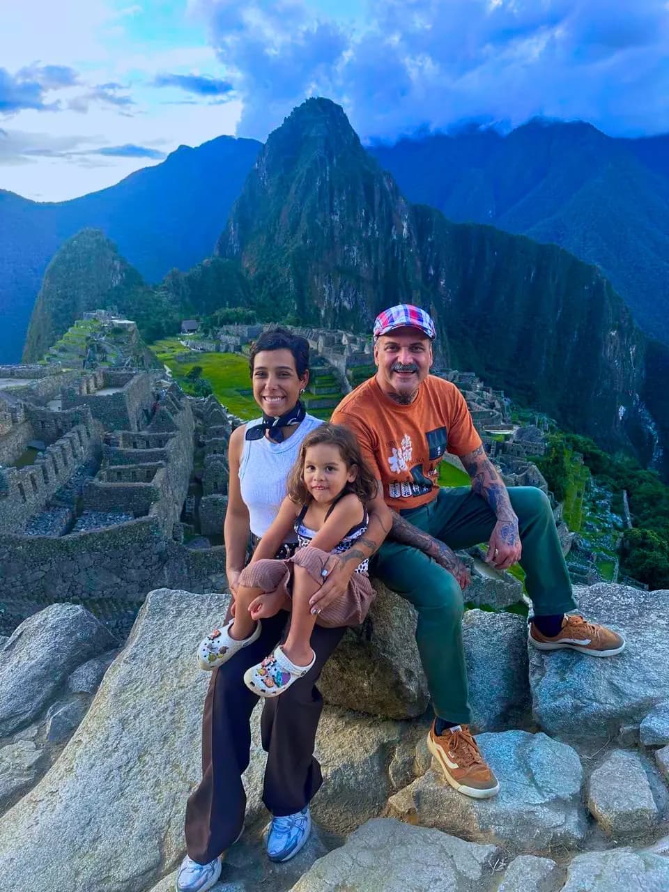 Family at Machu Picchu with Huayna Picchu in the background