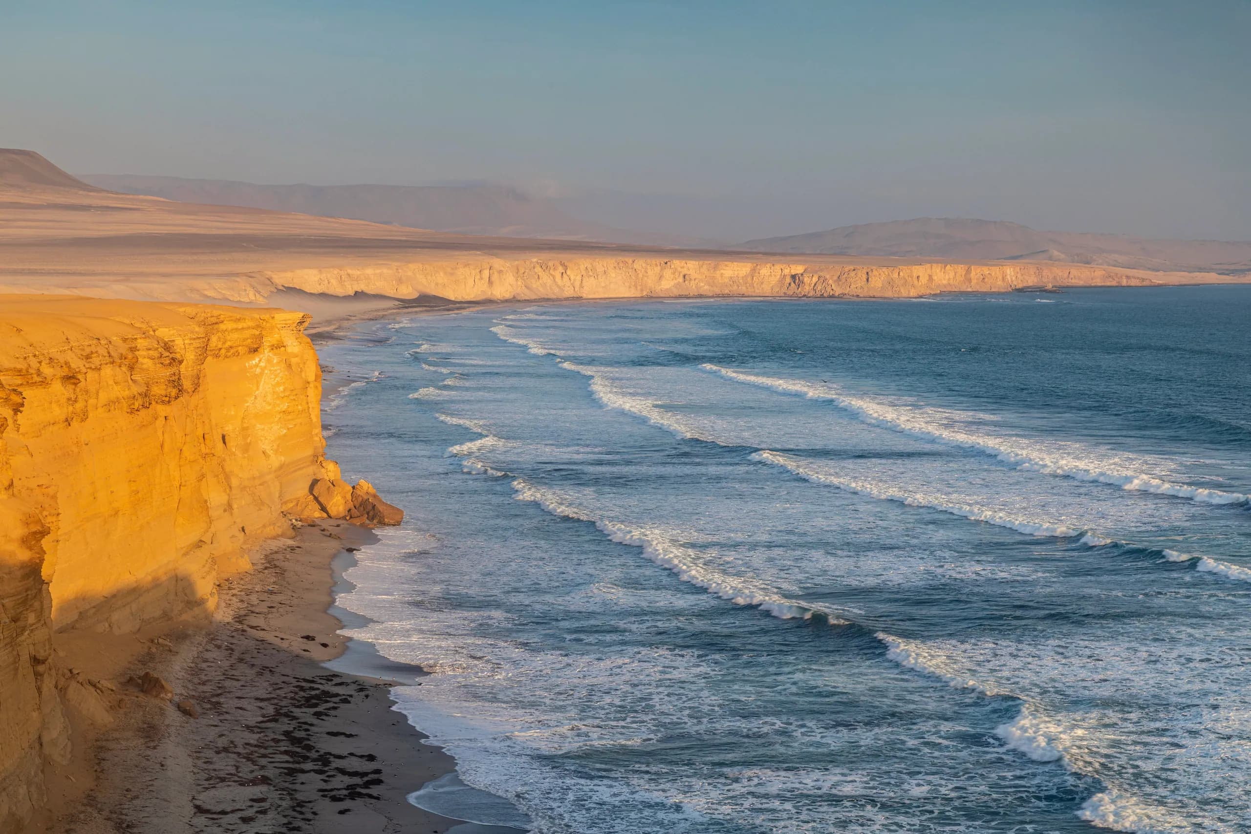 Desert coastline of Paracas beside the Pacific Ocean