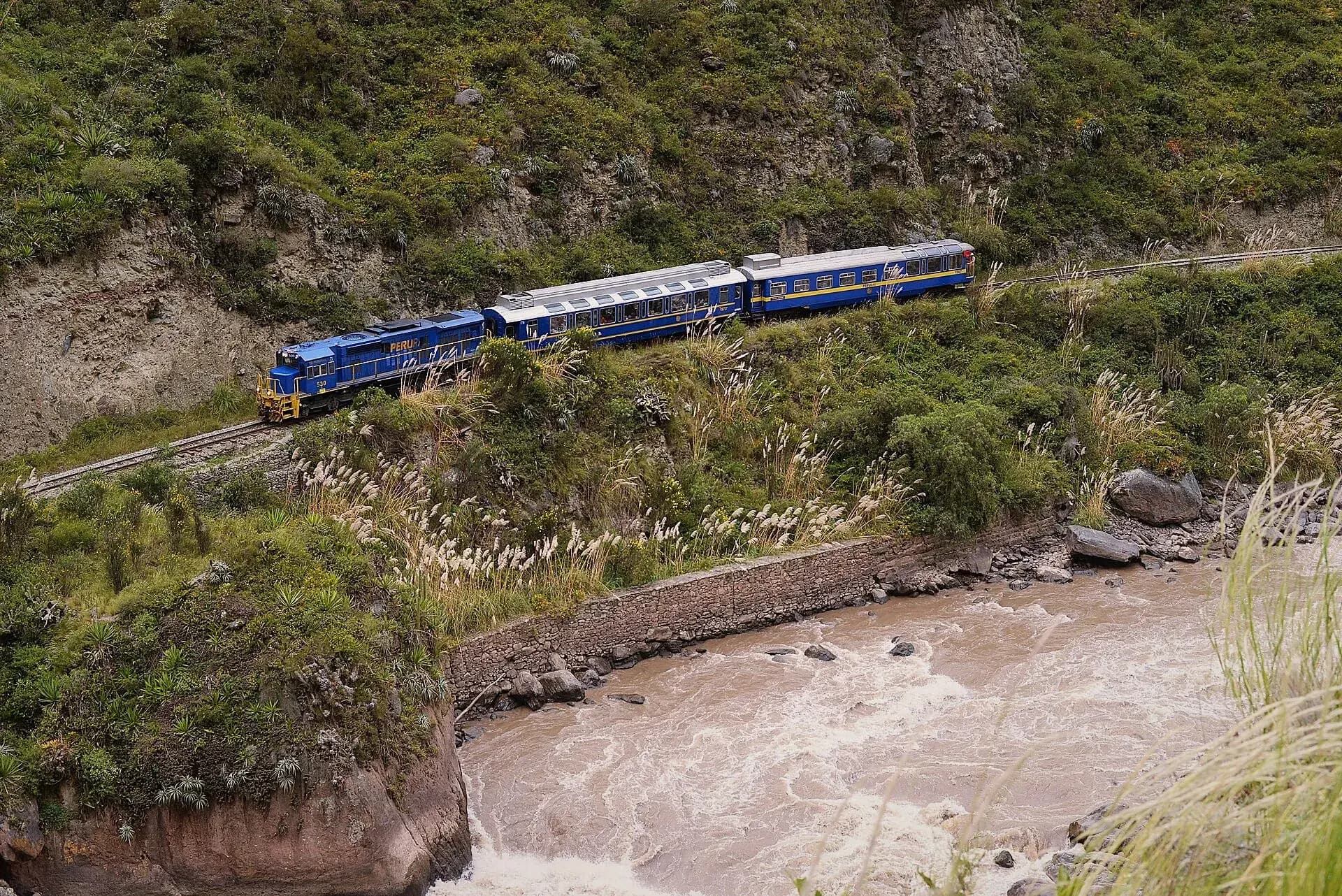 PeruRail train beside the Urubamba River on the route to Machu Picchu
