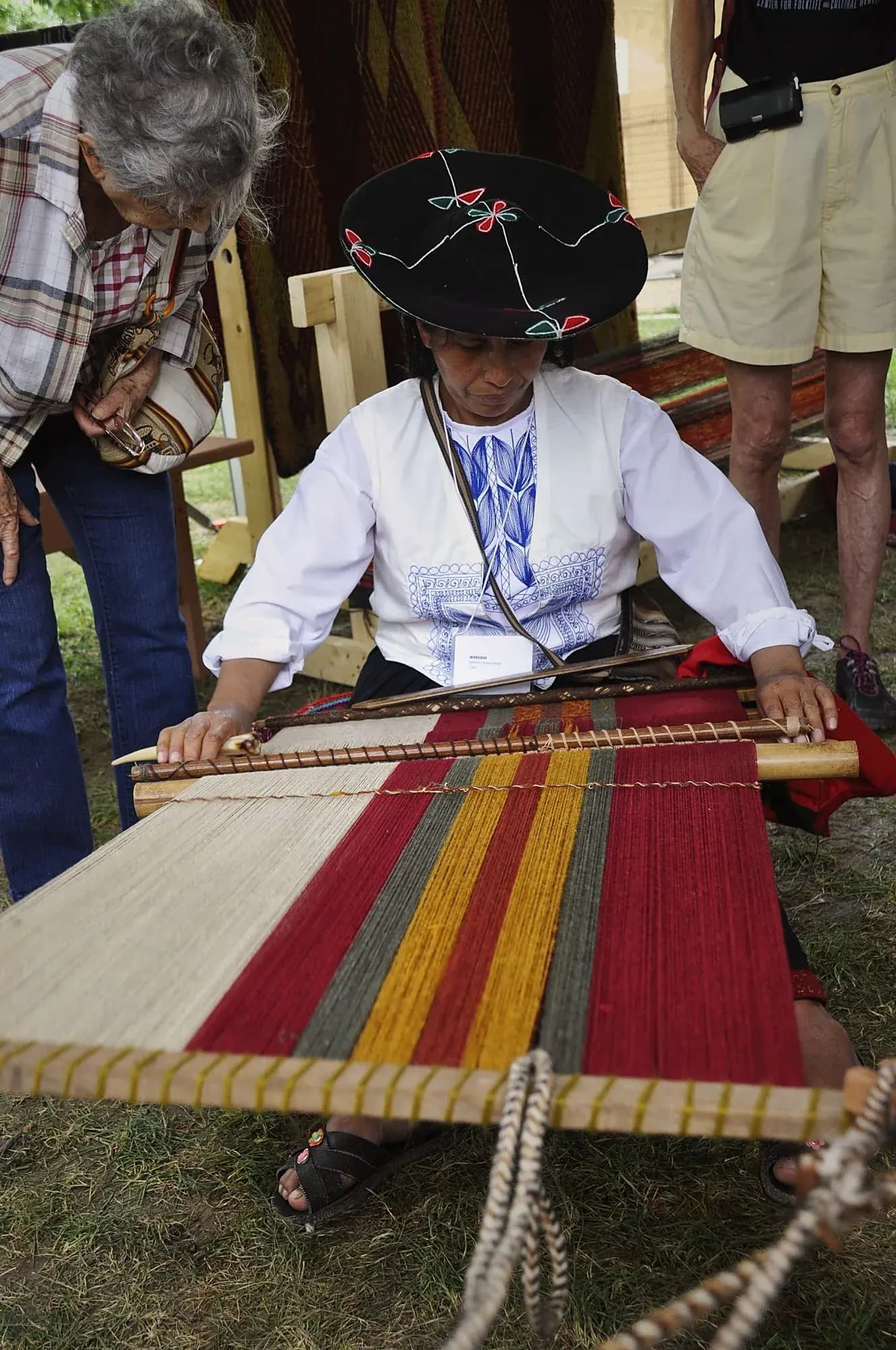 Cusco weaver working at a loom