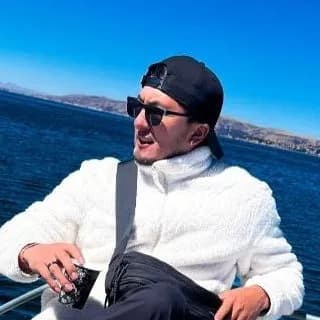 Giovanni, travel specialist at Vacations in Peru, on a boat on Lake Titicaca