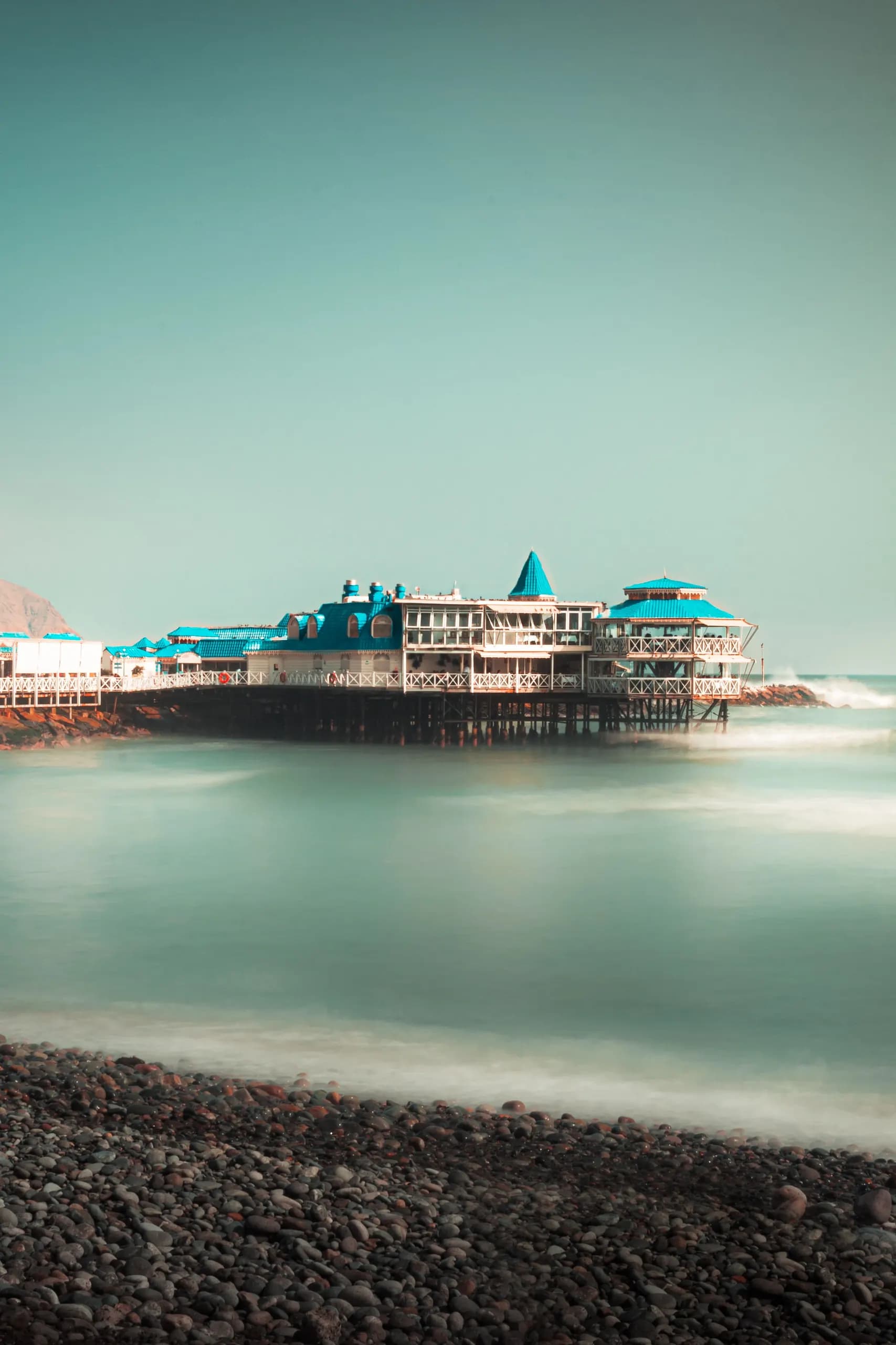 © Lyon Peru · Pexels La Rosa Náutica restaurant over the ocean, viewed from the beach in Miraflores, Lima
