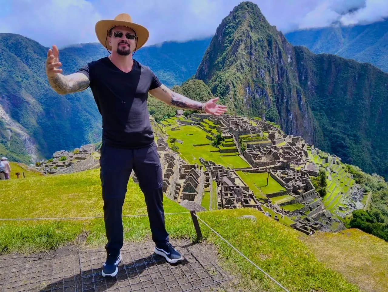 Traveller with open arms at Machu Picchu