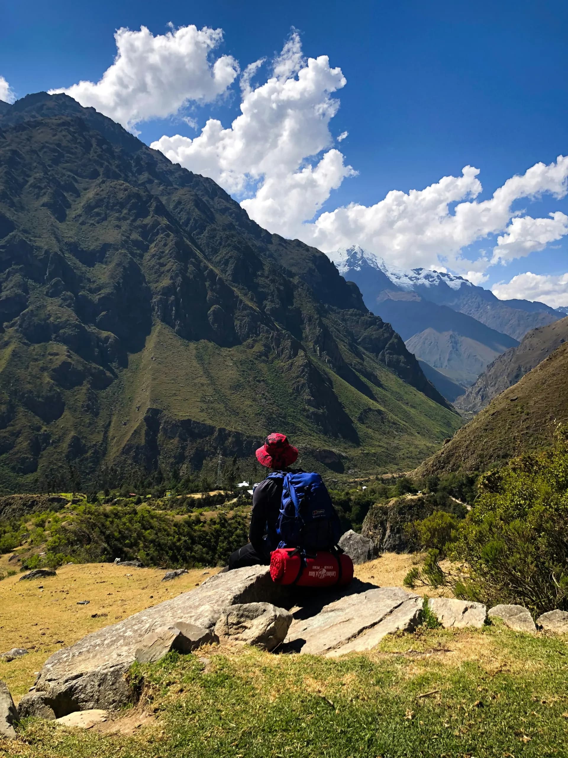 © Samuel Malmström · Unsplash Hiker resting in front of Salkantay mountain